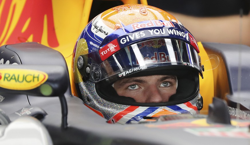 Red Bull driver Max Verstappen of the Netherlands waits in his car during the first practice session for the Japanese Formula One Grand Prix at the Suzuka International Circuit in Suzuka, central Japa ...