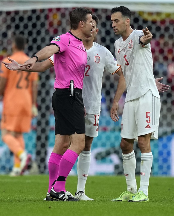 epa09326886 German referee Felix Brych talks to Sergio Busquets (R) of Spain during the UEFA EURO 2020 semi final between Italy and Spain in London, Britain, 06 July 2021. EPA/Frank Augstein / POOL (R ...