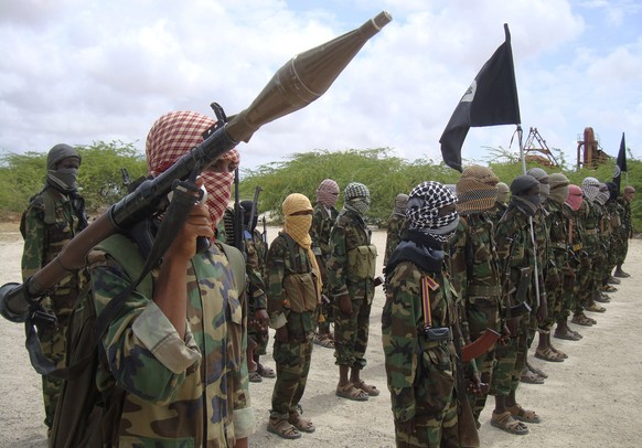 FILE - Al-Shabaab fighters display weapons as they conduct military exercises in northern Mogadishu, Somalia, on Oct. 21, 2010. The United Nations Security Council on Thursday Nov. 9, 2023 suspended f ...