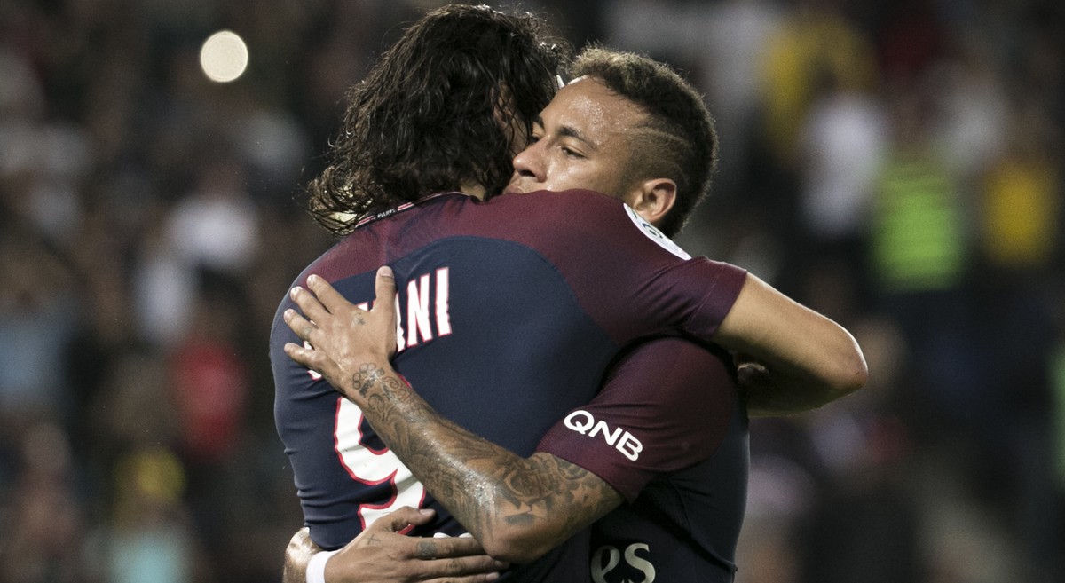PSG's Edinson Cavani, left, celebrates with teammate Neymar after scoring during the French League One soccer match between Paris Saint Germain and Saint Etienne at the Parc des Princes stadium i ...