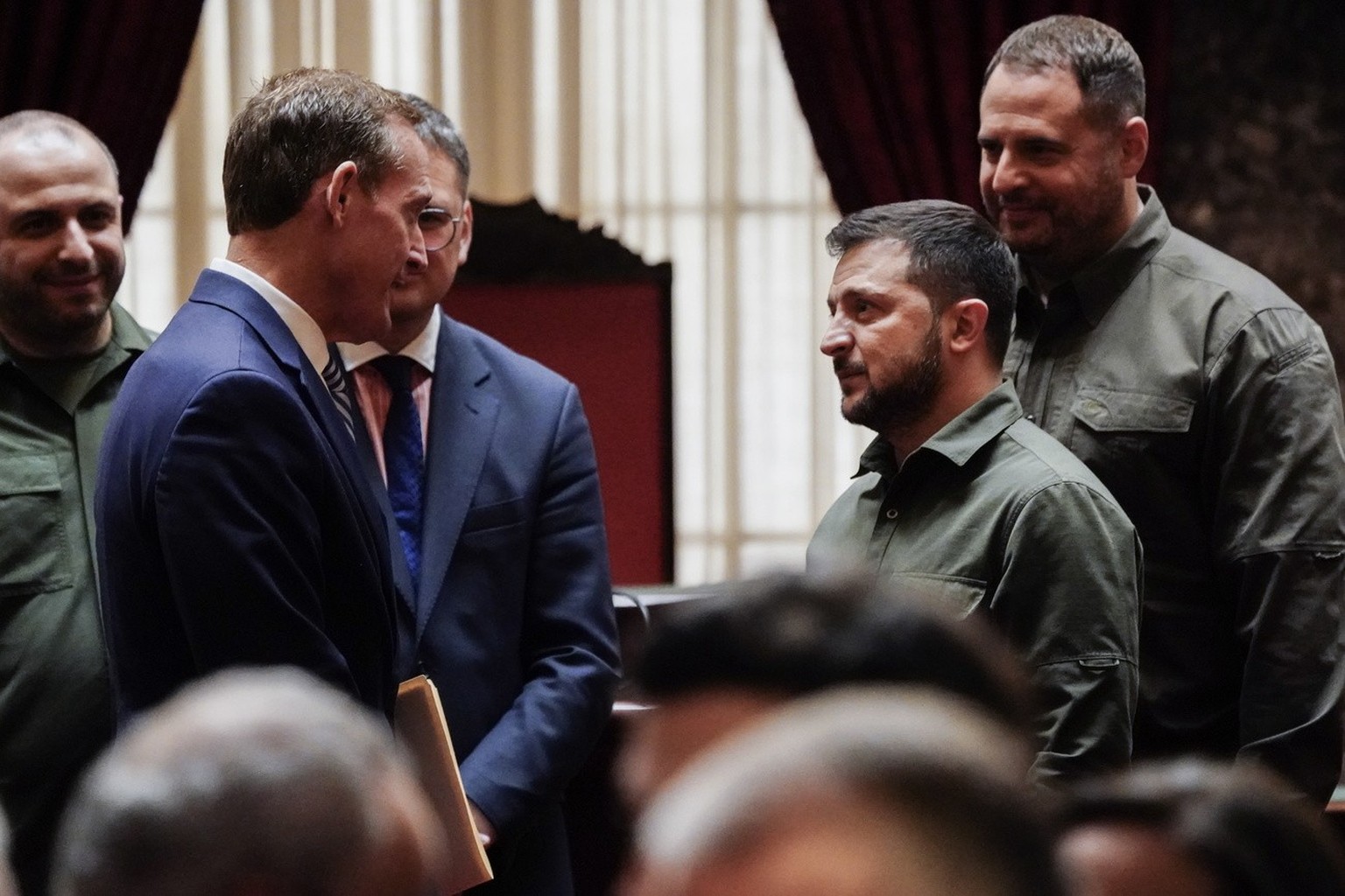 epa10874437 Ukrainian President Volodymyr Zelensky (2-R) talks to US Republican Senator from North Carolina, Ted Budd (2-L) as he meets with members of the US Senate in the Old Senate Chamber at the U ...