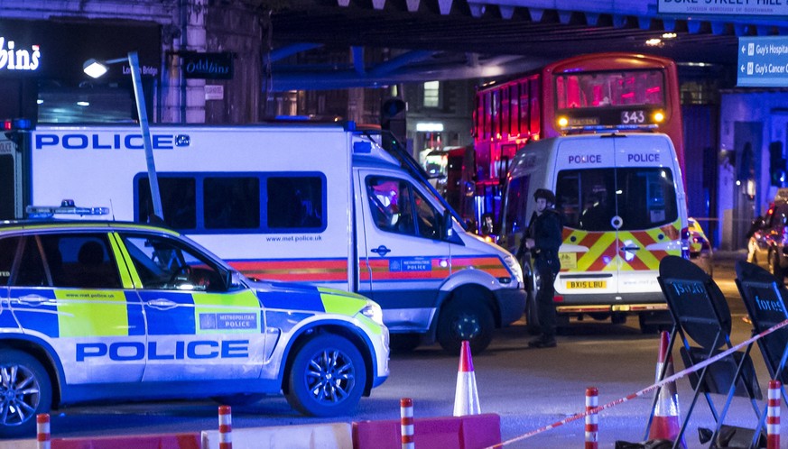 epa06009172 Police units at London Bridge after reports of a incident involving a van hitting pedestrian on London Bridge, Central London, Britain, 3 June 2017. The Metropolitan police have urged peop ...