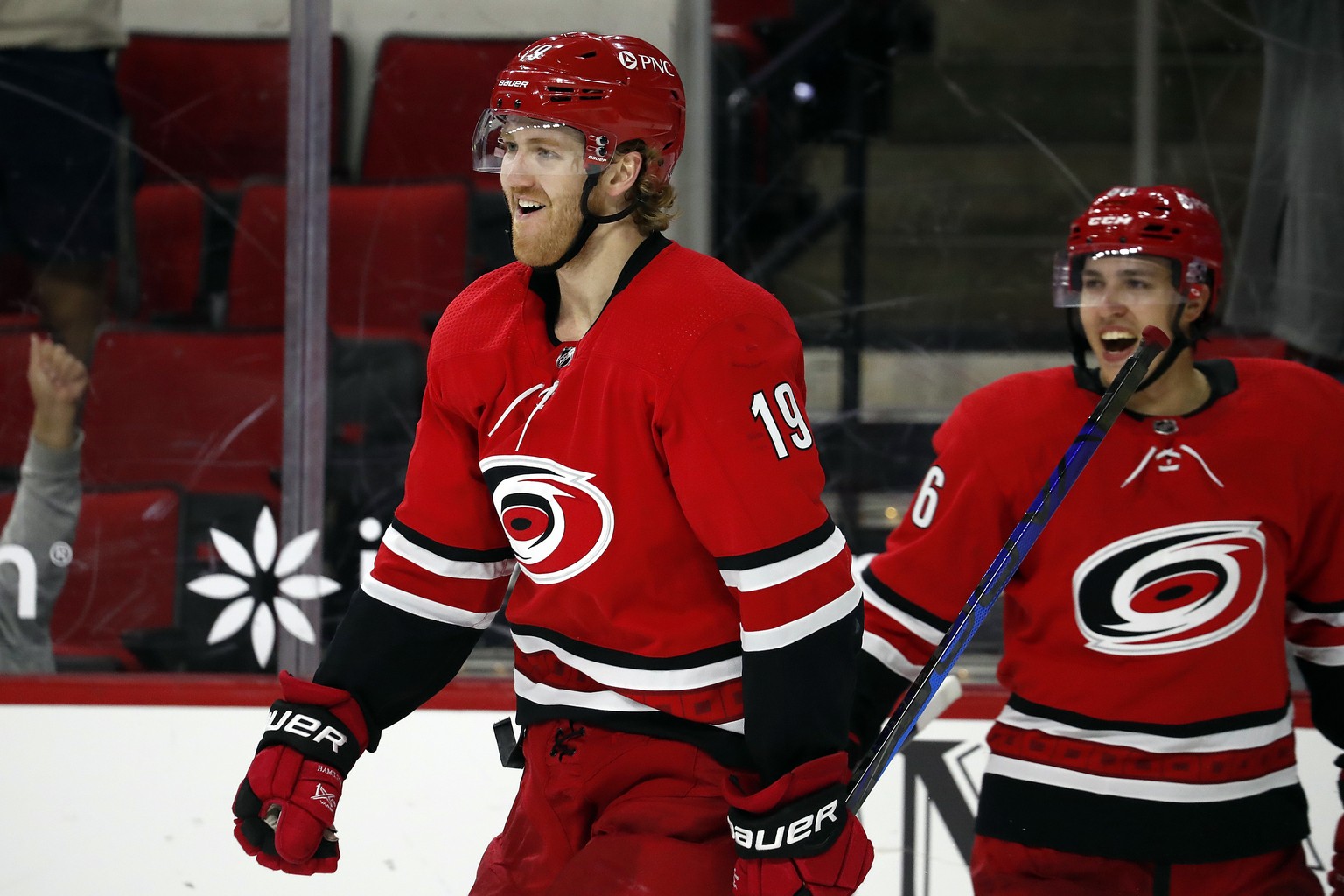 Carolina Hurricanes' Dougie Hamilton (19) celebrates his game-winning goal with teammate Teuvo Teravainen (86) in overtime of an NHL hockey game against the Columbus Blue Jackets in Raleigh, N.C. ...