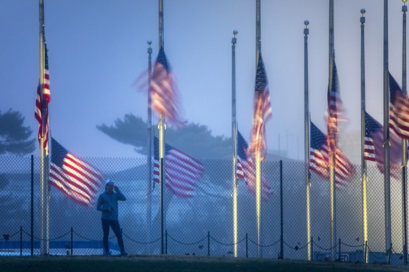 epa07202823 US flags on the National Mall fly at half-staff to honor the passing of former President George H.W. Bush in Washington, DC, USA, 01 December 2018. President Bush died at the age of 94 on  ...