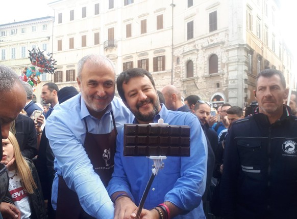 epa07936172 Leader of League (Lega) party Matteo Salvini (C-R) visits the Eurochocolate fest in Perugia, central Italy, 20 October 2019. The annual chocolate festival this year runs from 18 to 27 Octo ...