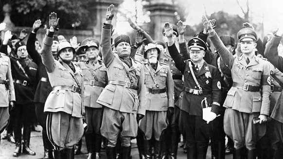 FILE - This Oct. 28, 1936 file photo shows Benito Mussolini, second from left, flanked by Nazis officers on the occasion of the celebration of the fourteenth anniversary of Italian Fascism. Not since  ...