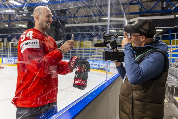 Switzerland&#039;s defender Christian Marti #54 jokes with a SRF cameraman, during a Switzerland team training session at the IIHF 2025 World Championship, at the Kvik Hockey Arena, in Herning, Denmar ...