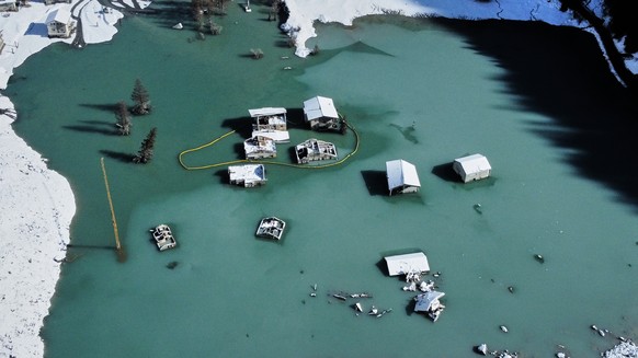 An aerial view shows the partly flooded village of Blatten after recent snowfalls, five months after a landslide destroyed the village, Blatten, Switzerland, on Tuesday, Oct. 28, 2025. (AP Photo/Micha ...