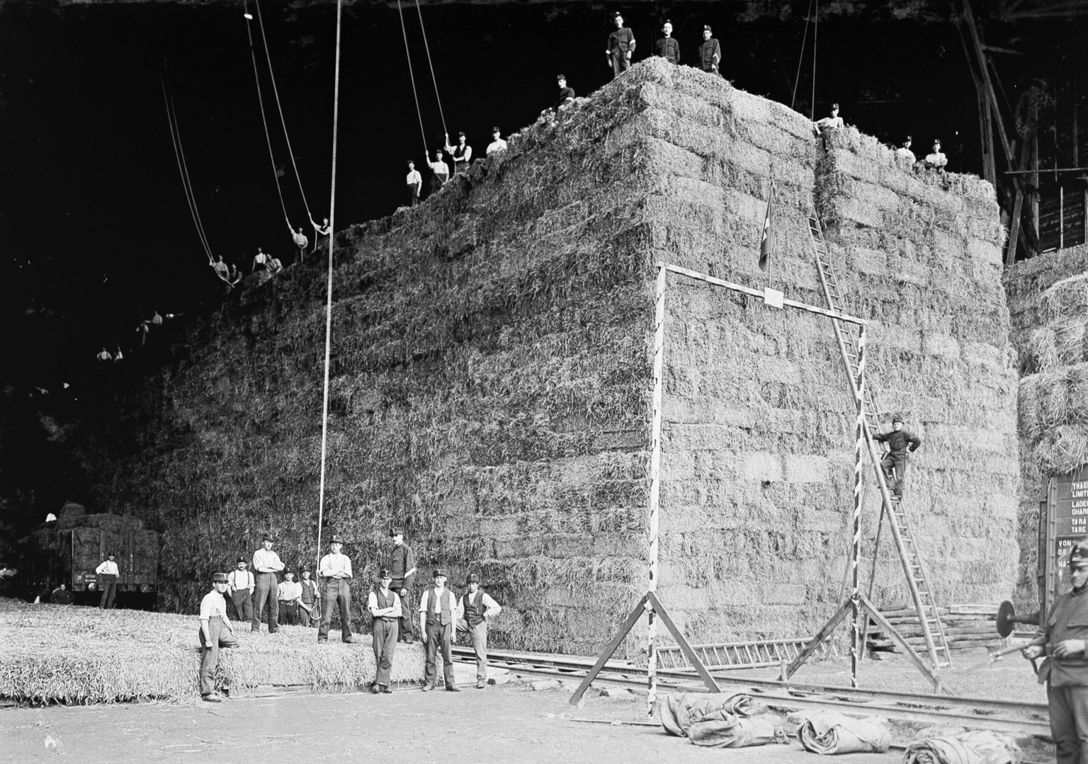 The airship base of the Schweizerische Luftverkehrs AG Ad Astra in Lucerne, Switzerland, is used as a storehouse for hay and straw by the Swiss Armed Forces and later as storehouse by the Kriegsernaeh ...