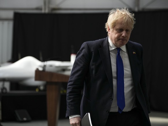 British Prime Minister Boris Johnson walks away after delivering a speech at Lydd Airport, south east England, Thursday, April 14, 2022. Britain says it has struck a deal with Rwanda to send some asyl ...