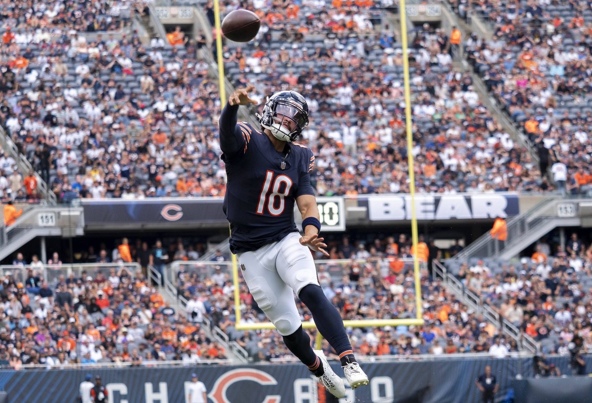 CHICAGO, IL - AUGUST 17: Chicago Bears quarterback Caleb Williams 18 passes the ball to his teammate during a preseason game between the Cincinnati Bengals and the Chicago Bears on August 17, 2024, at ...