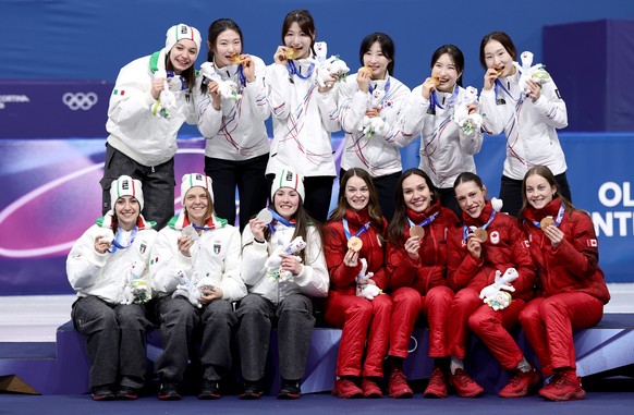 epa12755837 Gold medalists South Korea, silver medalists Italy (L) and bronze medalists Canada (R) celebrate on the podium during the medal ceremony for the Women's 3000m Relay of the Short Track ...