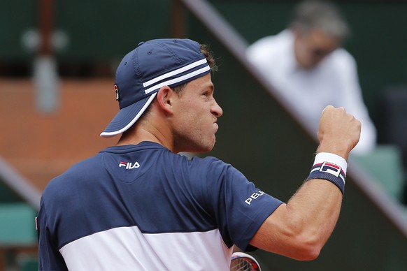 Argentina&#039;s Diego Schwartzman clenches his fist after scoring a point against Spain&#039;s Rafael Nadal during their quarterfinal match of the French Open tennis tournament at the Roland Garros s ...