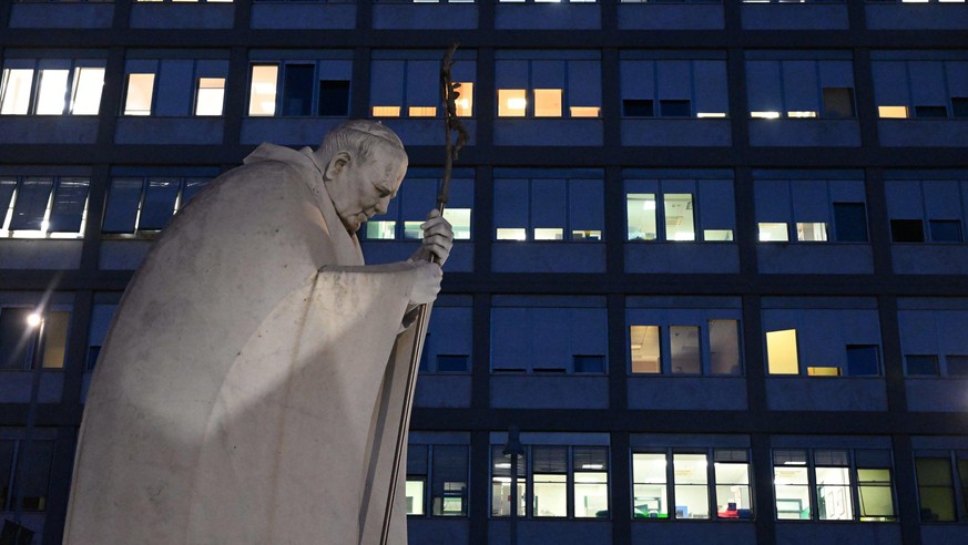 epa10549462 A statue of late Pope St. John Paul II in front of the Agostino Gemelli hospital in Rome, Italy, 29 March 2023. Pope Francis is hospitalized following a respiratory infection (excluding th ...