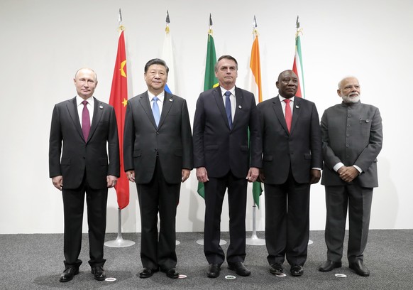 From left: Russian President Vladimir Putin, China&#039;s President Xi Jinping, Brazilian President Jair Bolsonaro, South African President Cyril Ramaphosa and Indian Prime Minister Narendra Modi pose ...