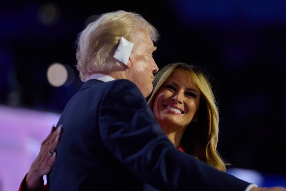 epaselect epa11486868 Republican presidential nominee Donald J. Trump (L) and his wife Melania Trump (R) react at the end of the fourth day of the Republican National Convention (RNC) at Fiserv Forum  ...