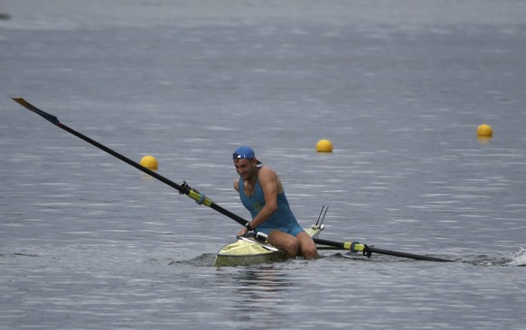 2016 Rio Olympics - Rowing - Repechage - Men&#039;s Single Sculls Repechages - Lagoa Stadium - Rio De Janeiro, Brazil - 08/08/2016. Vladislav Yakovlev (KAZ) of Kazakhstan after capsizing. REUTERS/Carl ...