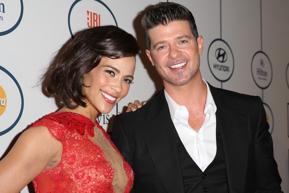 Links sehen Sie die zukünftige Ex-Frau von Robin Thicke. Rechts: Robin Thicke.