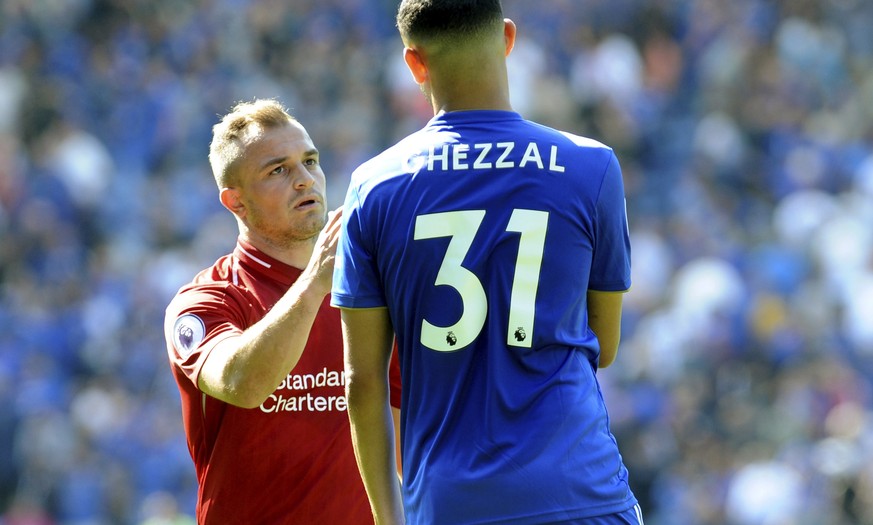 Liverpool&#039;s Xherdan Shaqiri, left, consoles Leicester City goal scorer Rachid Ghezzal after the English Premier League soccer match between Leicester City and Liverpool at the King Power Stadium  ...