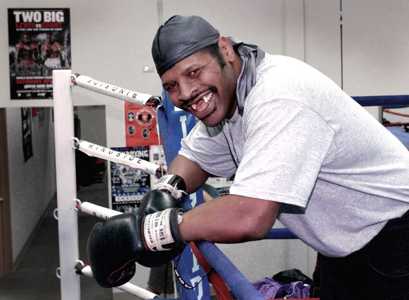 Leon Spinks, known for his toothless smile and for once beating Muhammad Ali, leans on the ropes at a boxing ring Tuesday, Jan. 23, 2001, in Lombard, Ill. Thursday, Feb. 15, marked the 23rd anniversar ...