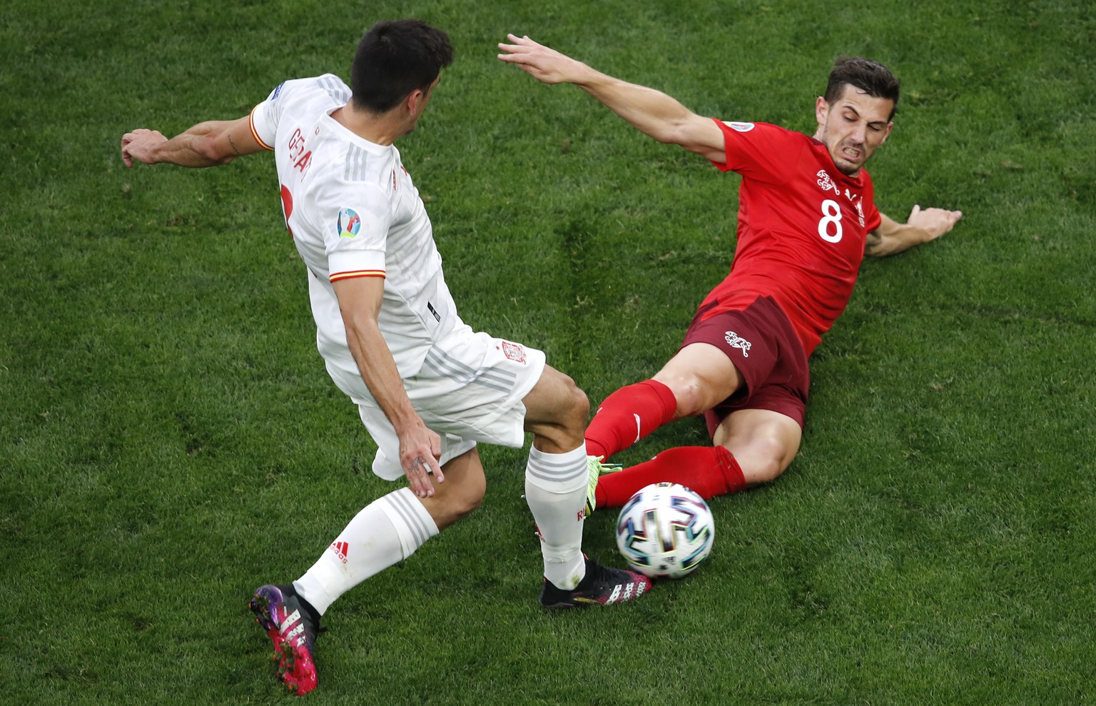 Switzerland&#039;s Remo Freuler, right, fouls Spain&#039;s Gerard during the Euro 2020 soccer championship quarterfinal match between Switzerland and Spain at Saint Petersburg Stadium in St. Petersbur ...