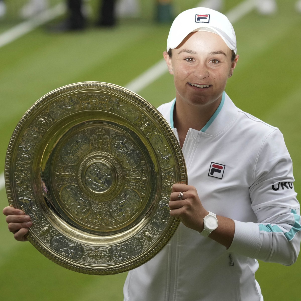 Australia's Ashleigh Barty holds the trophy after winning the women's singles final match against Czech Republic's Karolina Pliskova on day twelve of the Wimbledon Tennis Championships ...