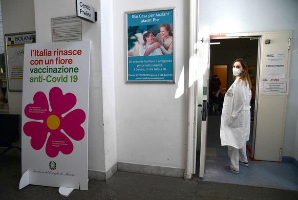 epa09045220 A Health worker prepares the vaccine doses to be administered to patients waiting at the hospital Galliera in Genoa, Italy, 01 March 2021. Italy started to vaccinate people over 65 year ol ...