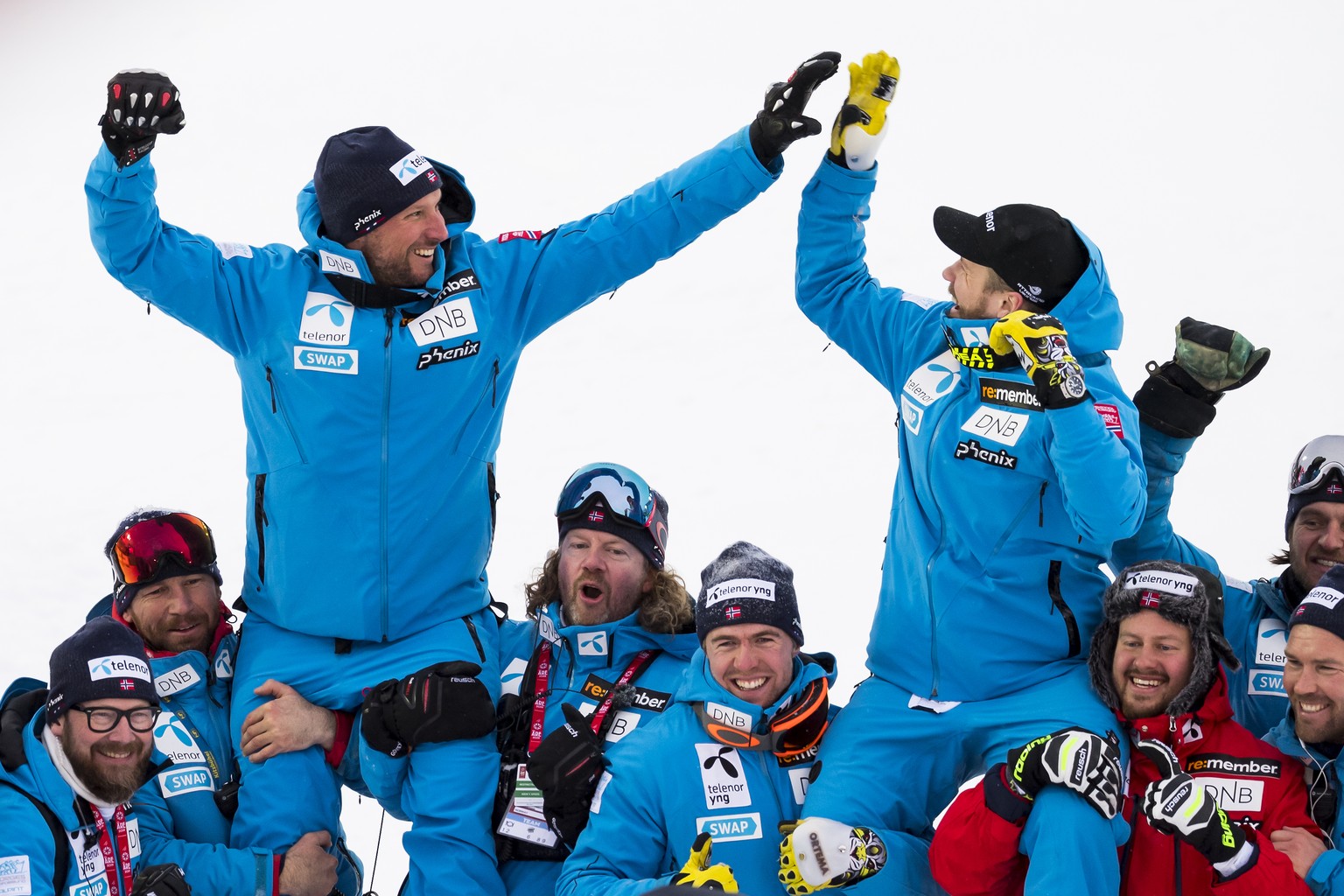 Aksel Lund Svindal of Norway, left, silver medal, and Kjetil Jansrud of Norway, right, gold medal, celebrate after the flower ceremony after the men downhill race at the 2019 FIS Alpine Skiing World C ...