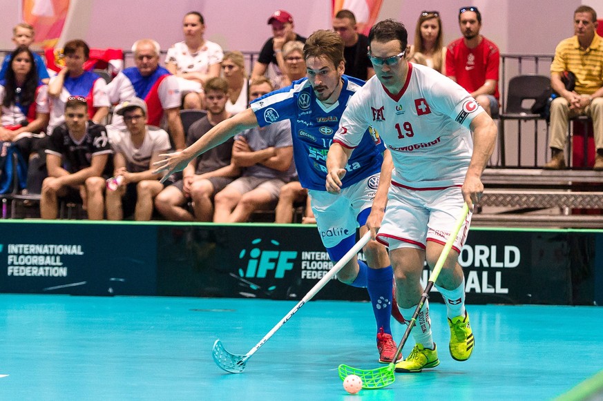 epa06116484 Matthias Hofbauer (R) of Switzerland and Janne Lamminen (L) of Finland during the men&#039;s Floorball match at the World Games of the non-Olympic sports in Wroclaw, Poland, 29 July 2017.  ...