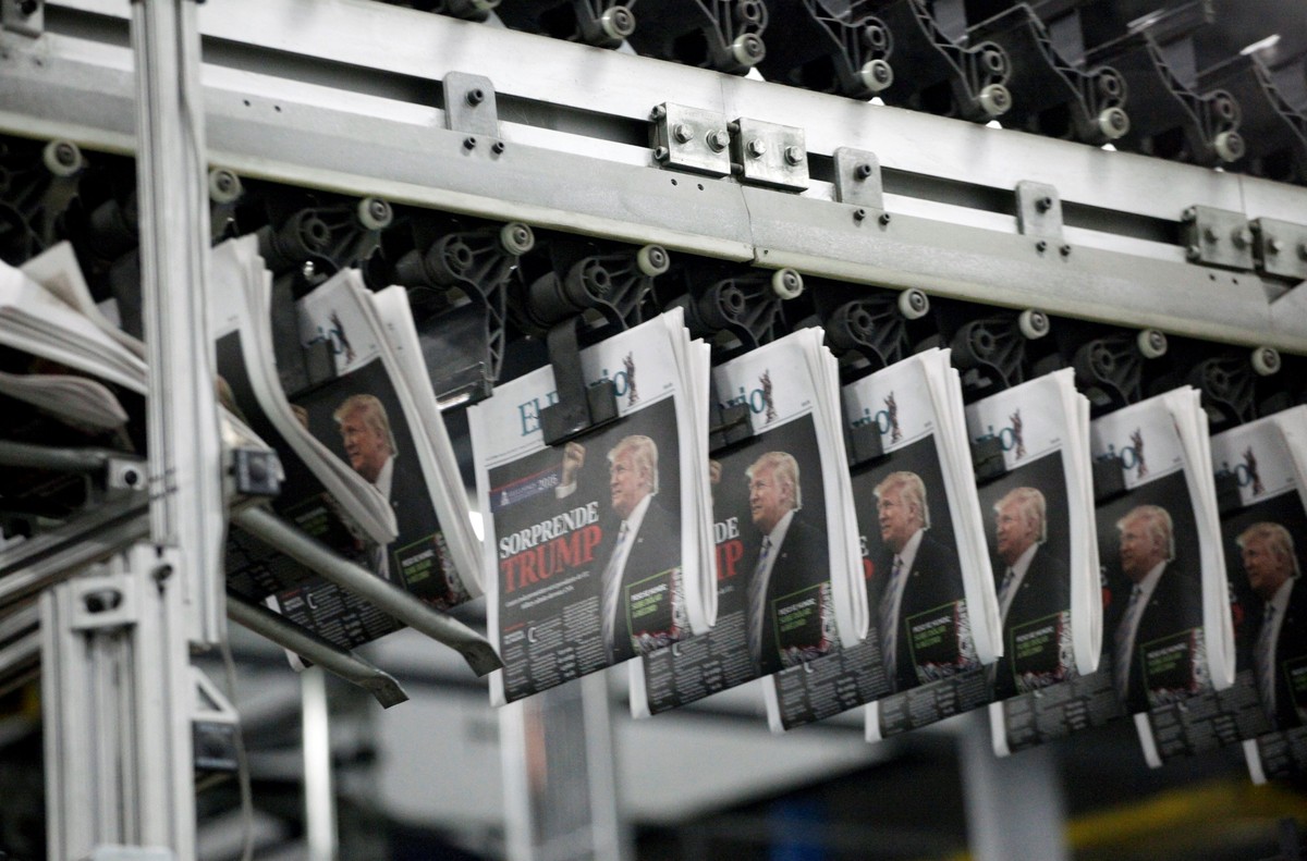 Freshly printed newspapers with the headline reading "Trump surprises" are seen at a conveyer belt at a printer of the local daily El Diario of Juarez in Ciudad Juarez, Mexico, November 9, 2 ...