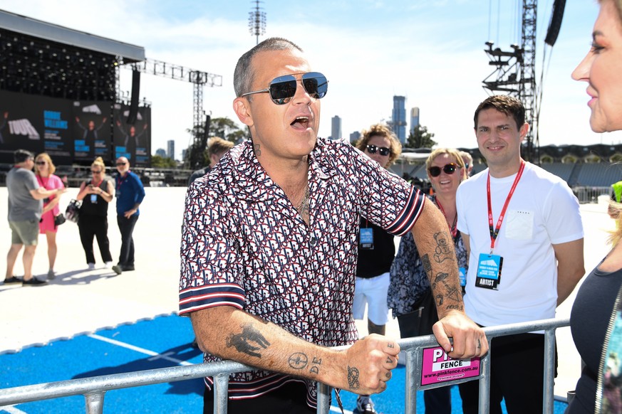 epa08287973 British singer Robbie Williams speaks to the media ahead of his performance at World Tour Melbourne, during a media opp at Lakeside Stadium in Melbourne, Australia. 12 March 2020. Williams ...