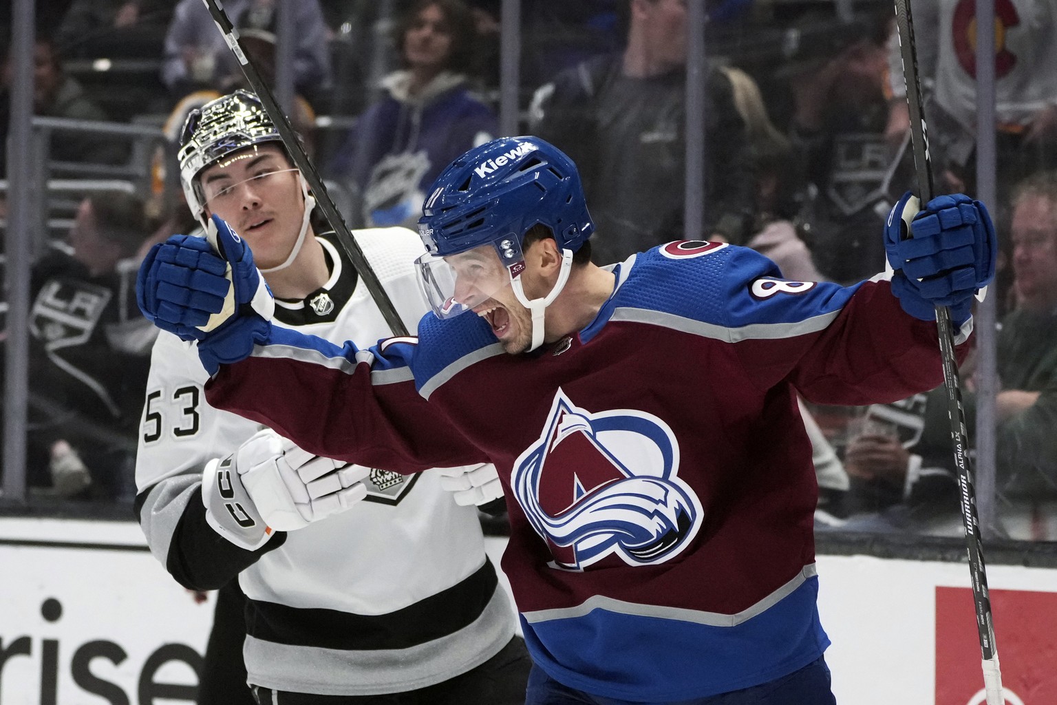 Colorado Avalanche center Denis Malgin, right, celebrates after scoring against the Los Angeles Kings during the third period of an NHL hockey game Saturday, April 8, 2023, in Los Angeles. (AP Photo/M ...