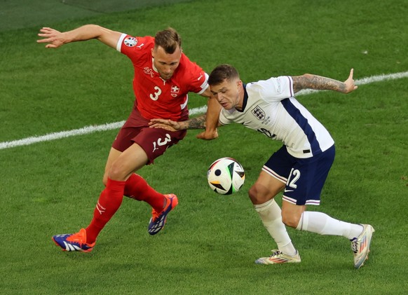 epa11463077 Silvan Widmer (L) of Switzerland and Kieran Trippier of England in action during the UEFA EURO 2024 quarter-finals soccer match between England and Switzerland, in Dusseldorf, Germany, 06  ...