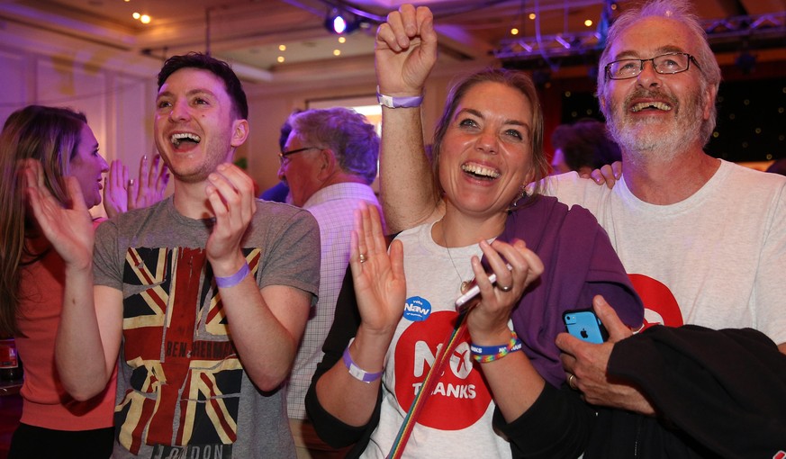 GLASGOW, SCOTLAND - SEPTEMBER 19: Better Together campaigners celebrate early poll results at a party on September 19, 2014 in Glasgow, Scotland. Polls have now closed in the Scottish referendum and t ...