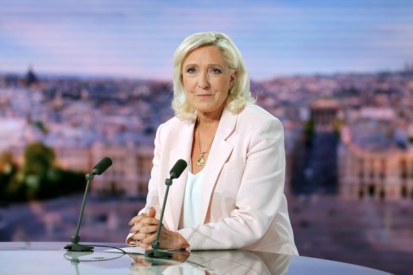 French far-right leader Marine Le Pen, member of parliament for the Rassemblement National (National Rally - RN) party, poses prior to an interview on the evening news broadcast of French TV channel T ...