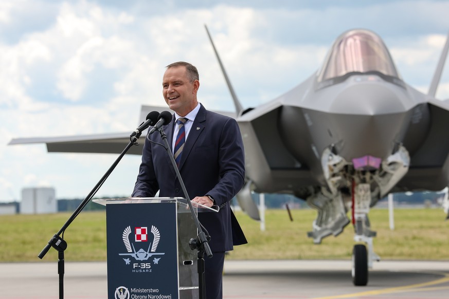 epa13032279 Polish President Karol Nawrocki speaks during the ceremony of F-35 fighter jets officially joining the Polish Armed Forces at 332nd Tactical Air Base in Lask, central Poland, 12 June 2026. ...