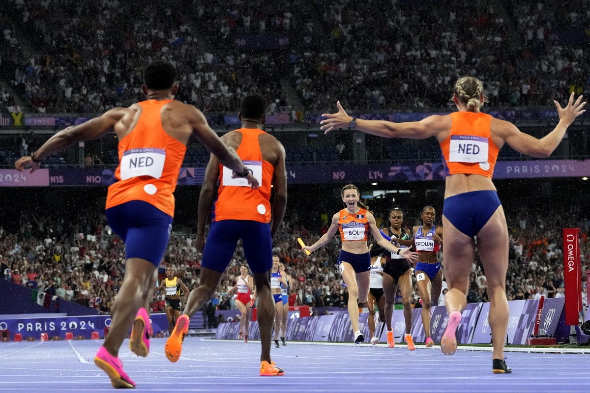 Femke Bol, of the Netherlands, celebrates was she anchors her team to victory in the 4x400-meter relay mixed final at the 2024 Summer Olympics, Saturday, Aug. 3, 2024, in Saint-Denis, France. (AP Phot ...