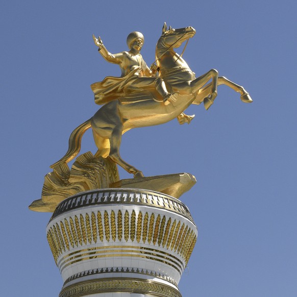 A view of the gilded monument &quot;Arkadag&quot;, installed in honour of former Turkmenistan president Gurbanguly Berdymukhamedov in the new Arkadag city, about 30 kilometers (20 miles) south of the  ...