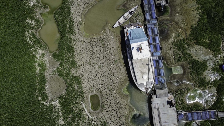 epa10075766 A photo taken with a drone shows the dry bed of the Po River between Parma and Reggio Emilia, Italy, 17 July 2022. Northern Italy has been struggling with a drought that began in winter, f ...