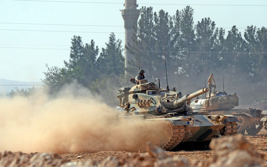 Turkish tanks head to the Syrian border, in Karkamis, Turkey, Wednesday Aug. 31, 2016. Turkey on Wednesday dismissed reports of a cease-fire deal with Kurdish rebels in northern Syria, and vowed to co ...