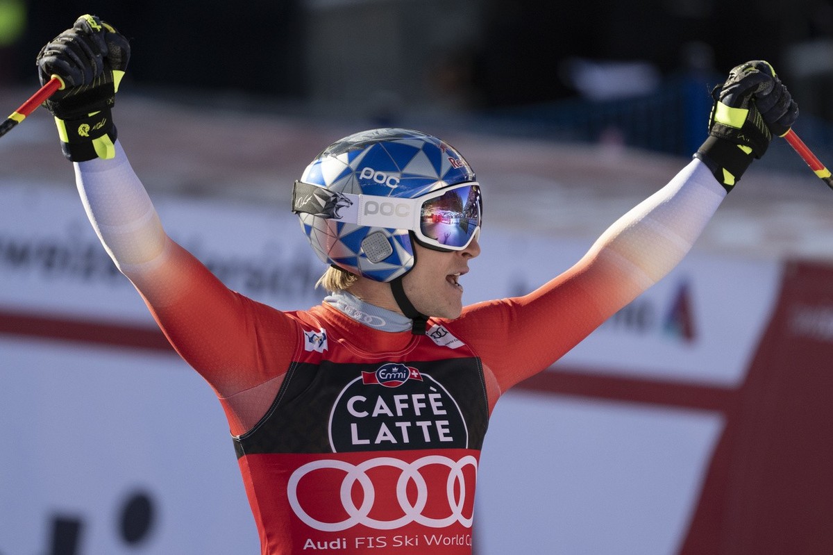 Marco Odermatt of Switzerland celebrates in the finish area during the flower ceremony after the men's downhill race at the Alpine Skiing FIS Ski World Cup in Wengen, Switzerland, Saturday, Janua ...