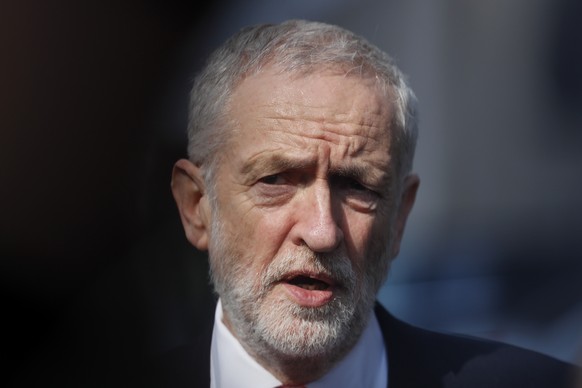 FILE - In this Thursday, March 21, 2019 file photo, British Labour Party leader Jeremy Corbyn speaks outside EU headquarters in Brussels. Cross-party talks in Britain aimed at striking a compromise Br ...