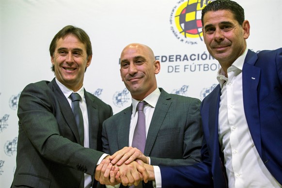 epa06755433 Spanish national soccer team head coach Julen Lopetegui (L) poses for photographers with Luis Rubiales (C), new president of the Royal Spanish Football Federation (RFEF), and RFEF sports d ...