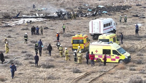 epa11792888 Emergency specialists work at the crash site of a passenger plane near Aktau, Kazakhstan, 25 December 2024. Azerbaijan Airlines Embraer ERJ-190AR passenger plane flying from Baku to Grozny ...