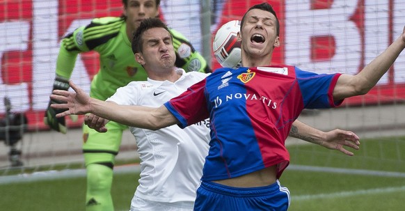 FCB&#039;s Marek Suchy, right fights for the ball with FCZ&#039;s Mario Gavranovic, left, during the Swiss Cup final soccer match between FC Basel and FC Zurich at the Stade de Suisse stadium in Bern, ...