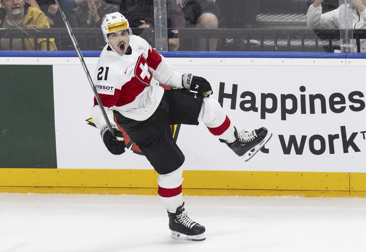 Switzerland's Kevin Fiala celebrates after scoring his side's third goal during the preliminary round match between Finland and Switzerland at the Ice Hockey World Championships in Prague, C ...