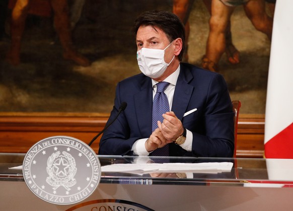 epa08860446 Italian Prime Minister Giuseppe Conte attends a press conference at Chigi Palace in Rome, Italy, 03 December 2020. Conte&#039;s cabinet approved a draft decree banning travel at Christmas  ...