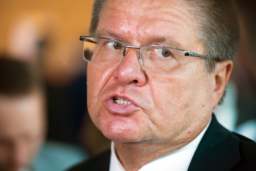 epa05339166 Russian Minister for Economic Affairs Alexej Uljukajew answers questions from the media after his speech at the Chamber for Industry and Commerce in Stuttgart, Germany, 31 May 2016. EPA/DE ...