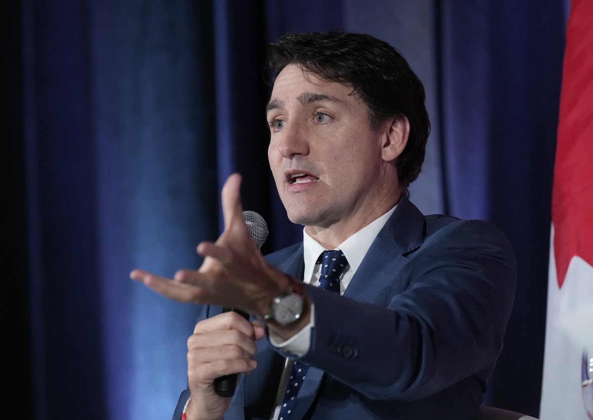 Prime Minister Justin Trudeau participates in an arm chair discussion at the Sustainable Finance conference, in Ottawa, Thursday Nov. 28, 2024. (Adrian Wyld /The Canadian Press via AP)
