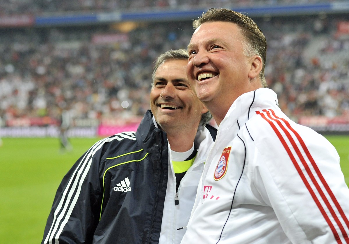 FILE - In this Friday, Aug. 13, 2010 file photo, the then Bayern Munich head coach Louis van Gaal, right, and the then Real Madrid's head coach Jose Mourinho as they smile prior to the friendly s ...